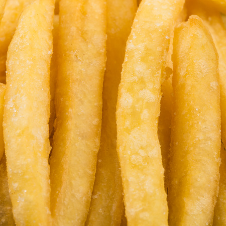 Fried french fry potatoes closeup for background