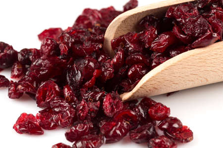 Pieces of dried cranberries isolated on white backgroundの写真素材