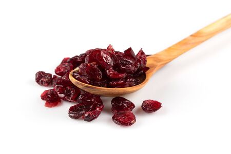 Pieces of dried cranberries isolated on white backgroundの写真素材