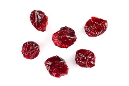 Pieces of dried cranberries isolated on white backgroundの写真素材