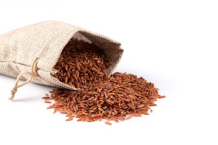 Heap of red rice isolated on white backgroundの写真素材