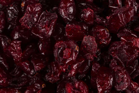 Pieces of dried cranberries close up for backgroundの写真素材