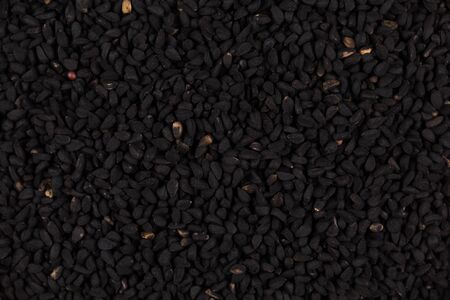 Sesame black seeds close up for background