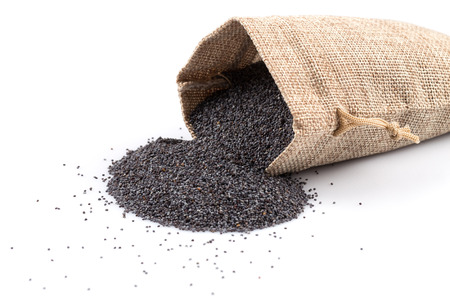 poppy seeds in a sack on a white backgroundの写真素材