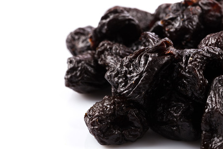 Dried plum - prunes fruits isolated on a white backgroundの写真素材