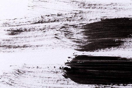 Black paint isolated on white paper backgroundの写真素材