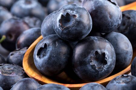 Fresh juicy blueberries isolated on white backgroundの写真素材