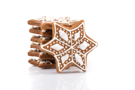 Star shape christmas gingerbread cookies isolated on white backgroundの写真素材