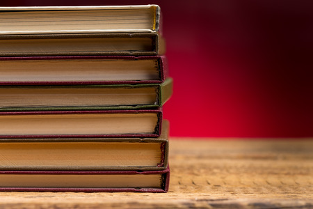 Books on wooden table close up photoの写真素材