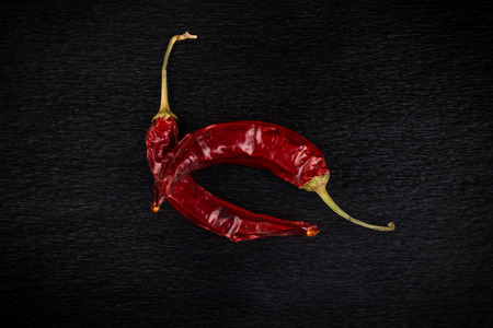 Red chili pepper, dried chillies on dark backgroundの写真素材