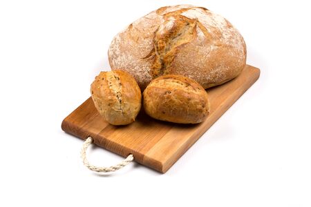 fresh baked bun bread isolated on whiteの写真素材