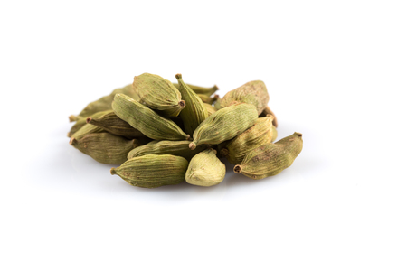 Heap of cardamom pods isolated on a white backgroundの写真素材