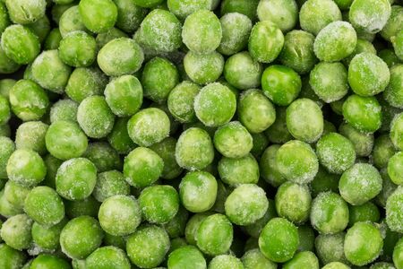 Green frozen raw peas vegetable for backgroundの写真素材