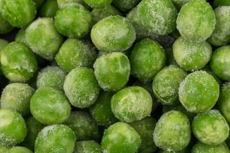 Green frozen raw peas vegetable for backgroundの写真素材