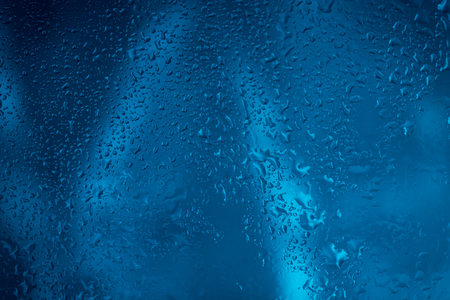 Drops of rain on glass , raindrops on clear windowの写真素材