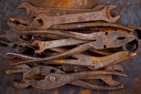 Dirty set of hand old rusty tools. Equipment for locksmith and metalworking shopの写真素材