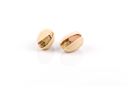 pistachio nut close up on white background isolatedの写真素材