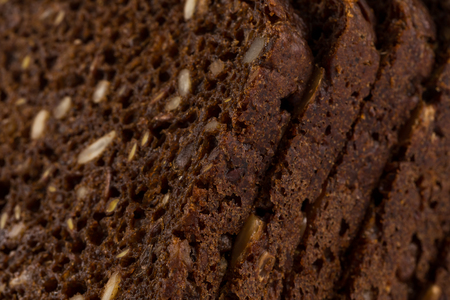 Dark rye bread with sunflower seeds  background
