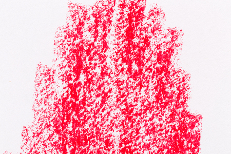 Red crayon draw on a white paperの写真素材