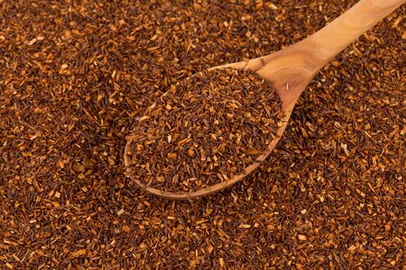 Heap of red dry rooibos healthy traditional organic tea in spoonの写真素材