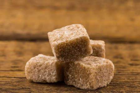 brown sugar on an old wooden tableの写真素材