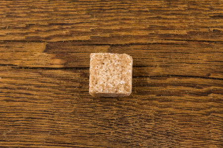brown sugar on an old wooden tableの写真素材
