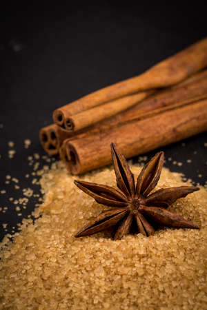 star anise on a background of the tropical brown sugarの写真素材