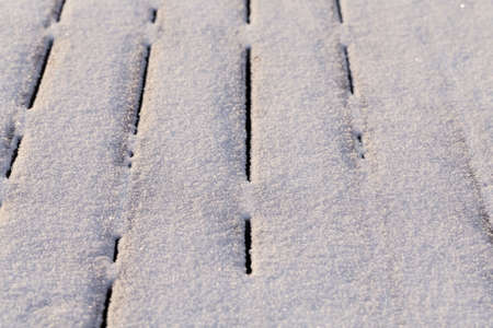 Snow covered wood terrace floor background texture