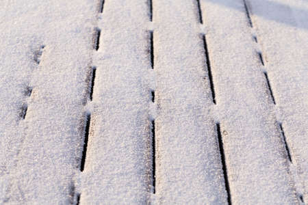 Snow covered wood terrace floor background textureの写真素材