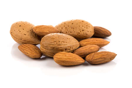 Pile of almonds nuts on a white backgroundの写真素材
