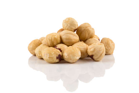 Closeup view of hazelnuts nuts pile on white backgroundの写真素材