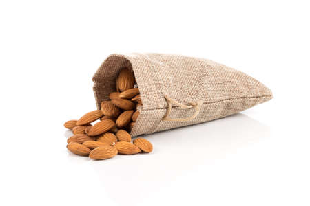 Sack of almonds nuts on a white backgroundの写真素材