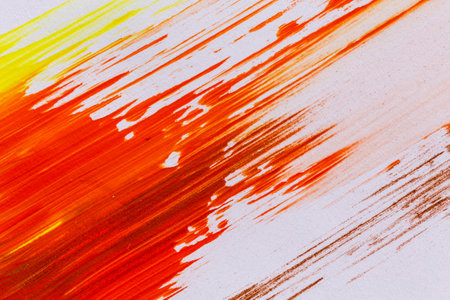 acrylic orange red yellow brown paint texture background hand made brush on paperの写真素材