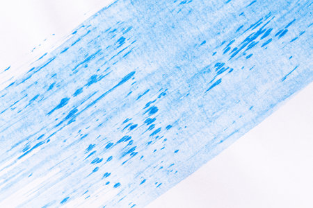 acrylic paint texture background blue color on white paper. Brush stroke. Hand made