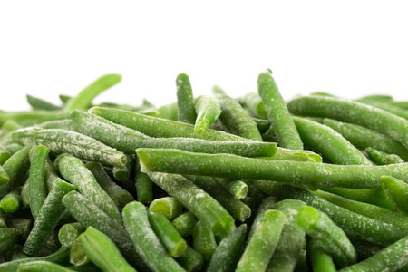Frozen cut green beans vegetable in a bowl, isolated on white
