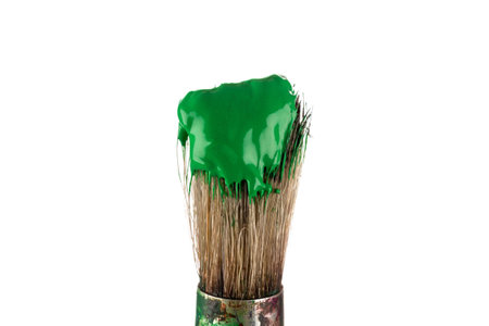 Brush with green paint isolated on white backgroundの写真素材