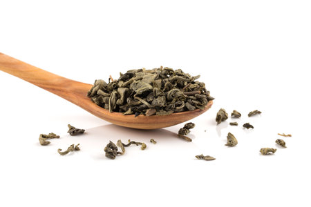 Gunpowder green tea in spoon isolated on a white backgroundの写真素材