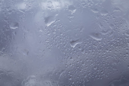 Drops of rain on glass raindrops on clear window