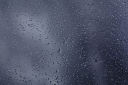 Drops of rain on glass raindrops on clear windowの写真素材