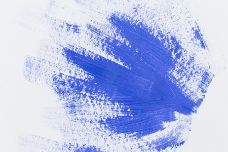 Blue stroke of the paint brush on white paper sketchの写真素材