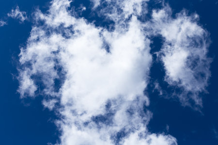 blue day sky background with white cloudsの写真素材