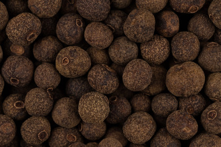 Large black pepper seeds corns as a backgroundの写真素材