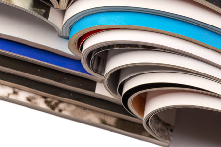 Stack of magazines on white background with reflectionの写真素材