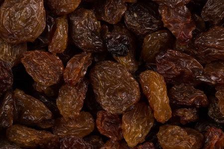 Sweet dry raisins close up shot for backgroundの写真素材