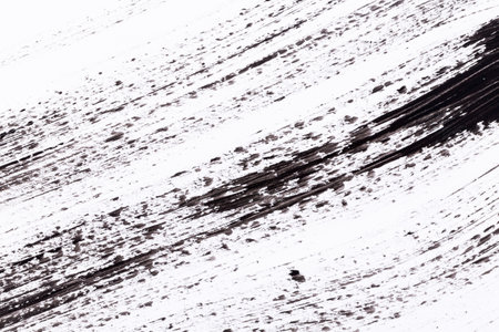 Black paint isolated on white paper backgroundの写真素材