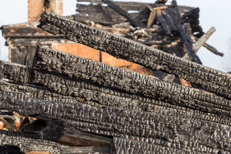 The charred ruins and remains of a burned down houseの写真素材