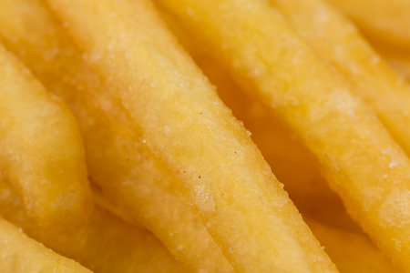 Fried french fry potatoes closeup for backgroundの写真素材