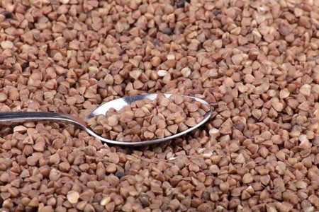 many of buckwheat background and teaspoonの写真素材