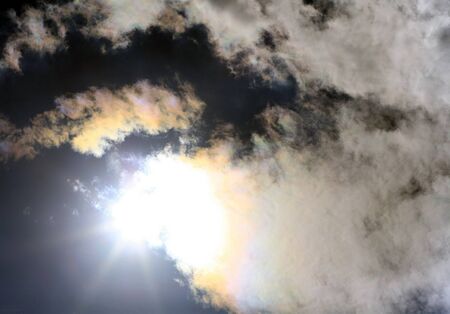 sun and white clouds on sky backgroundの写真素材