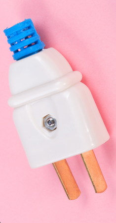 American Outlet Plug on pink backgroundの写真素材